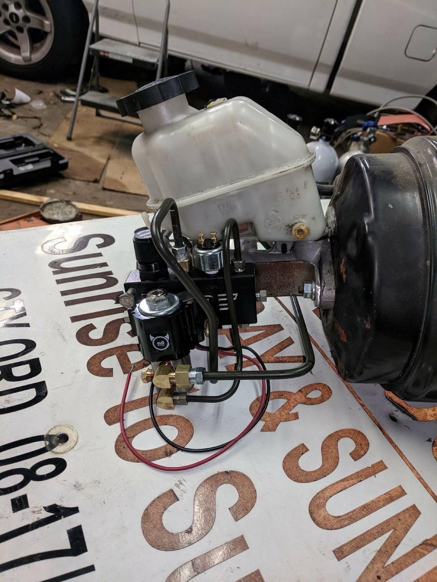 Master cylinder and valve assembly on bench