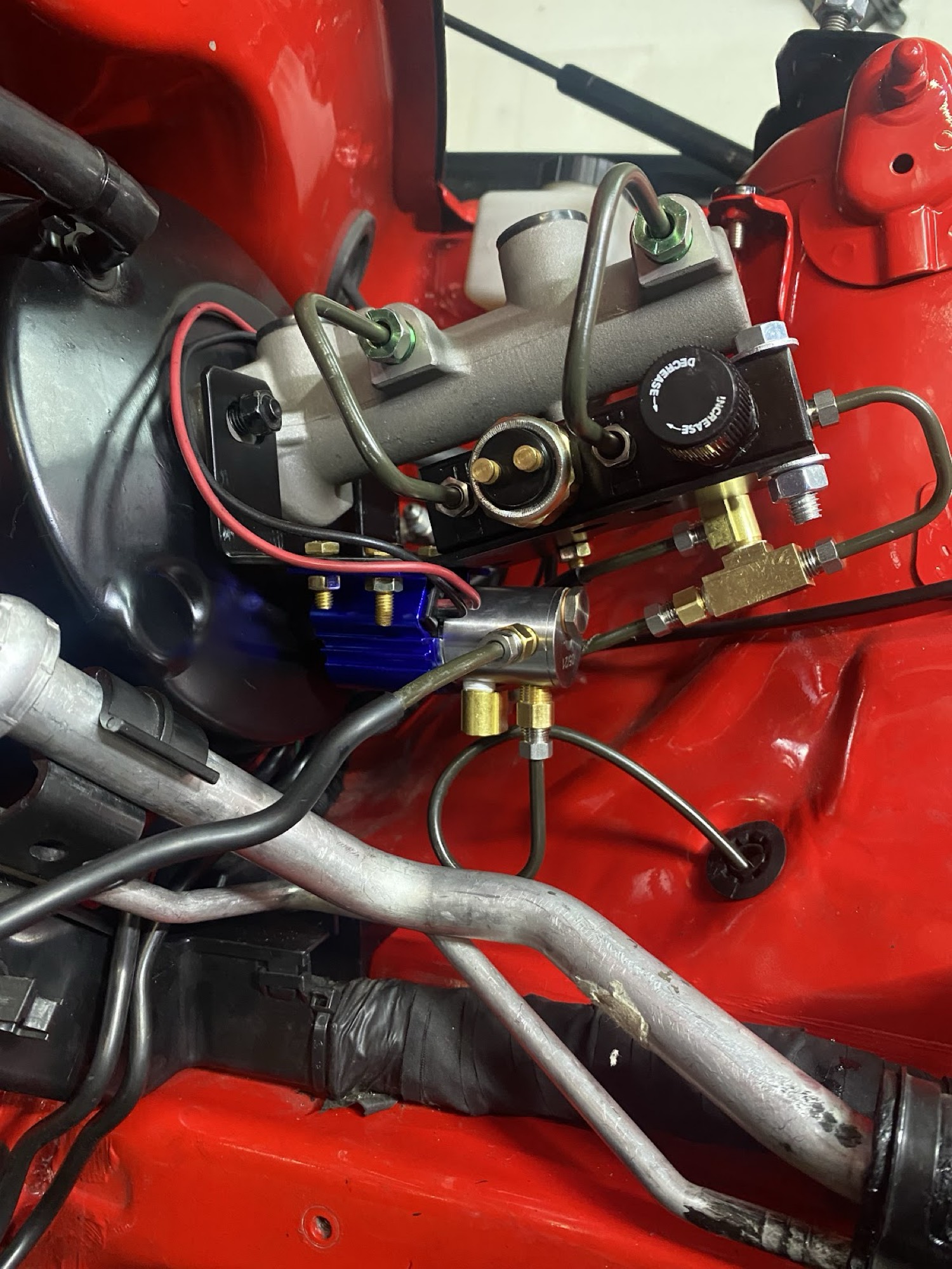 Proportioning valve plumbed after master cylinder