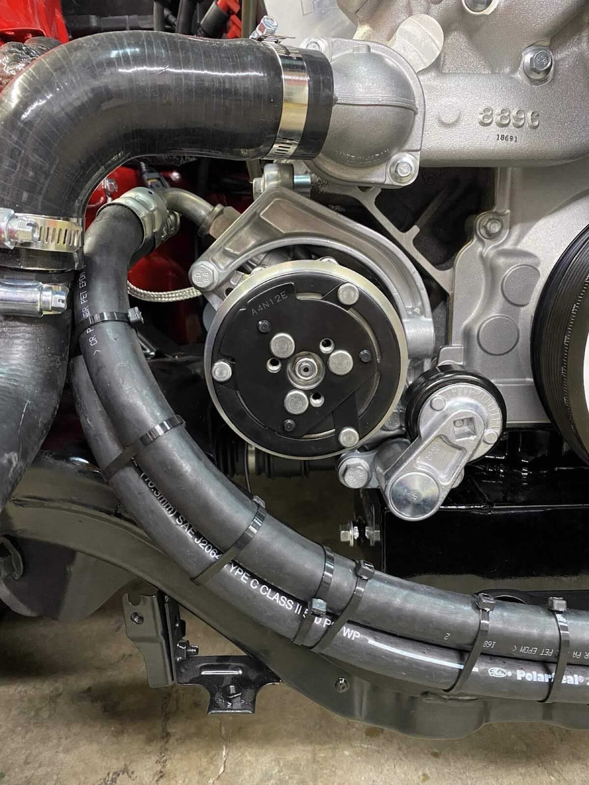 A/C compressor clutch and hose routing