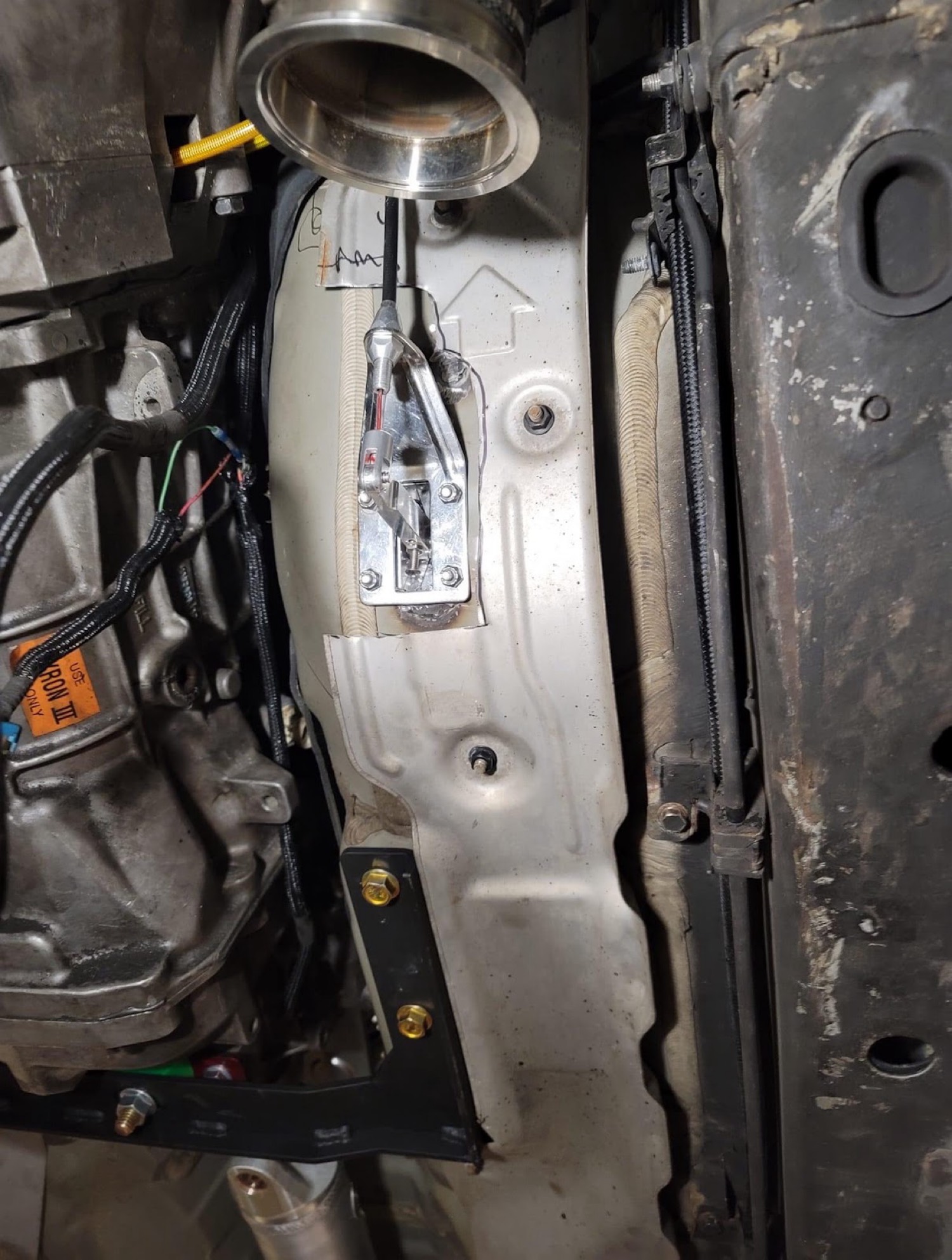 Cable throttle bracket through firewall