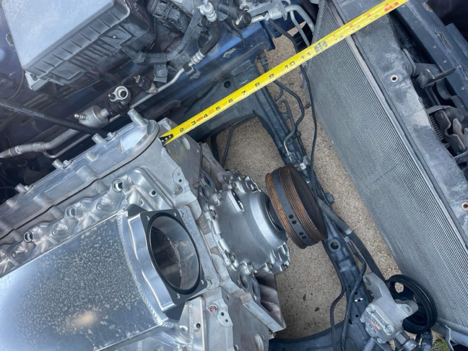 Tape measure reference across front of engine bay