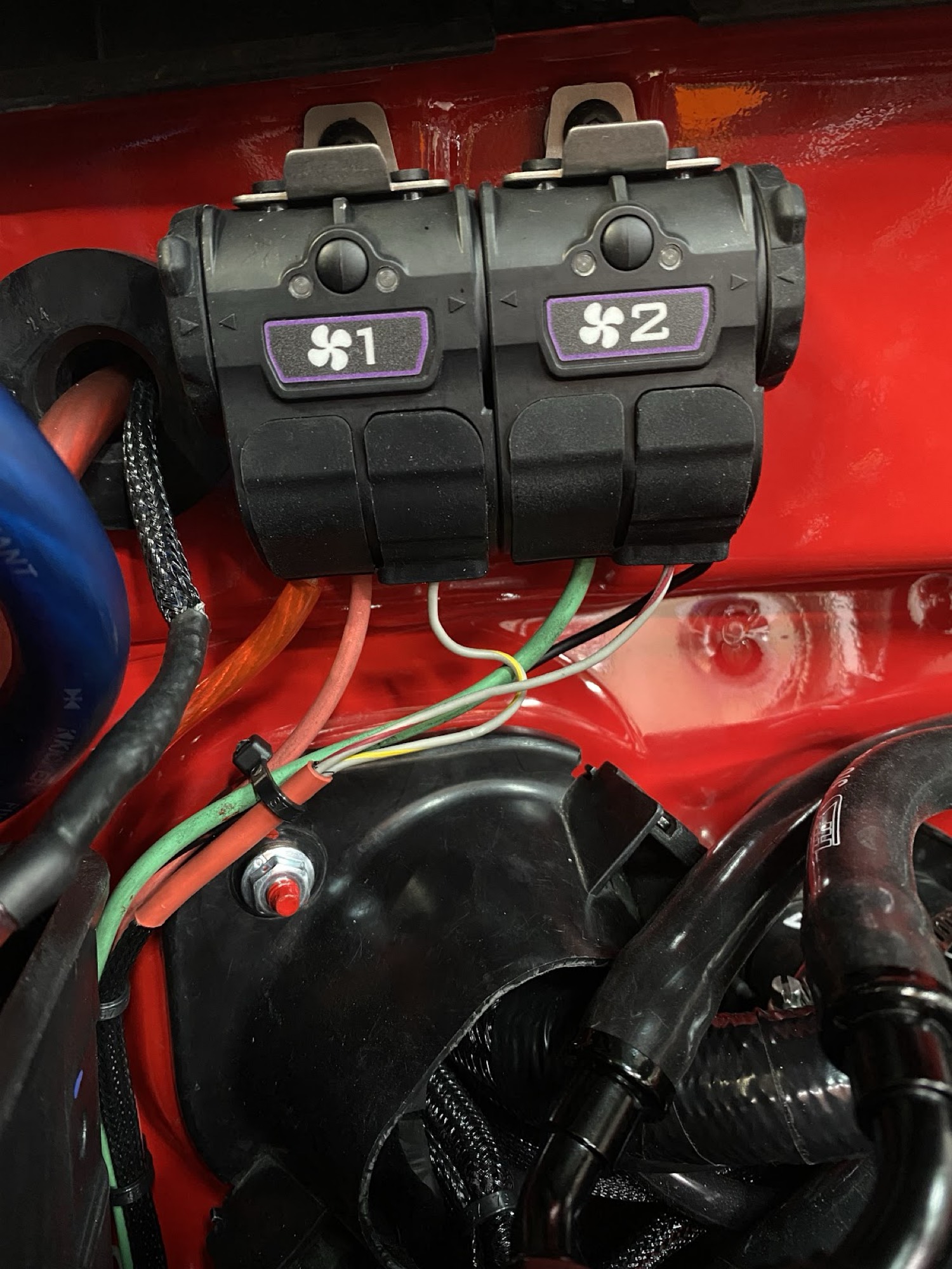 Fan 1 and fan 2 relays mounted near battery