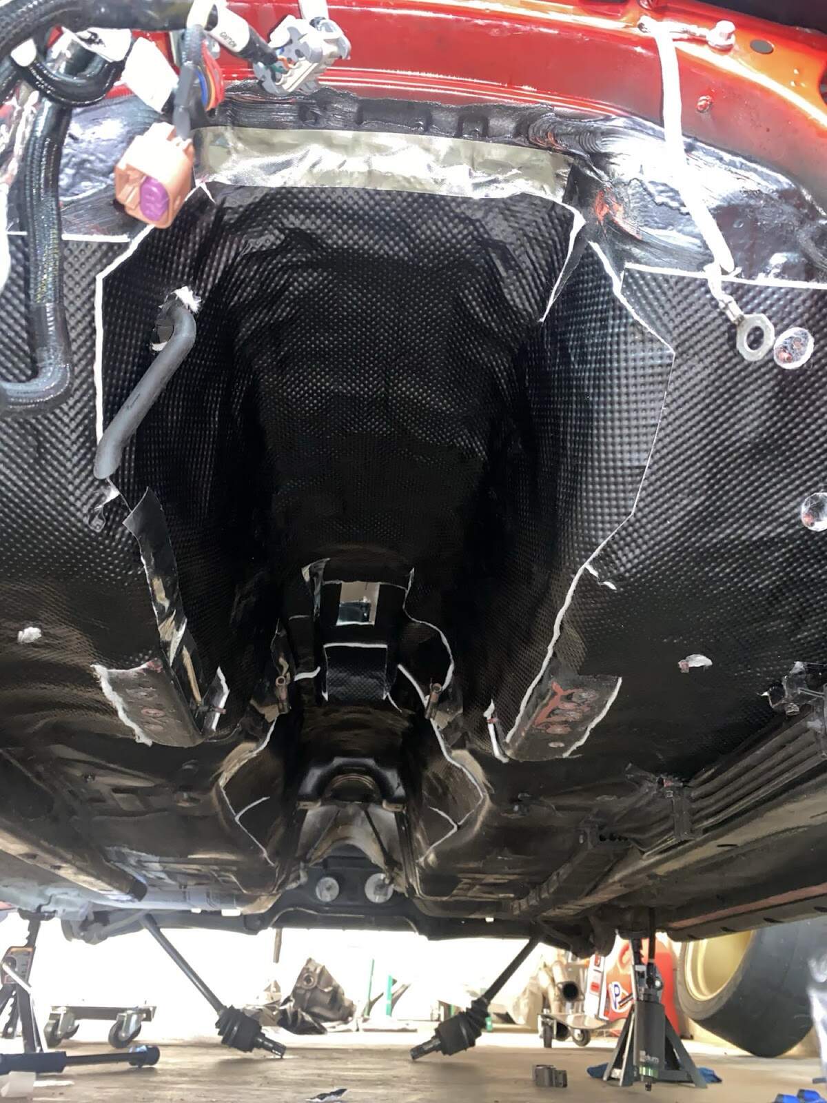 DEI shielding in transmission tunnel from underneath