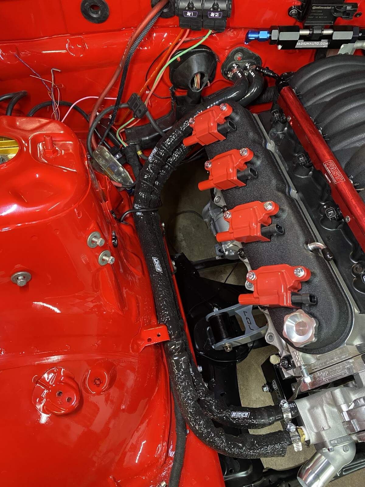 Heater hose routing along LS engine